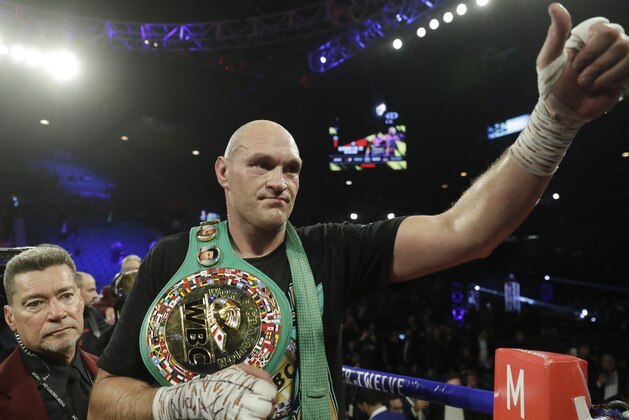 Tyson Fury, of England, celebrates after defeating Deontay Wilder during a WBC heavyweight championship boxing match Saturday, Feb. 22, 2020, in Las Vegas. (AP Photo/Isaac Brekken)