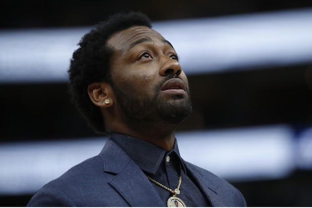 Washington Wizards John Wall looks on in the second half during an NBA basketball game against the Utah Jazz Friday, Feb. 28, 2020, in Salt Lake City. (AP Photo/Rick Bowmer)