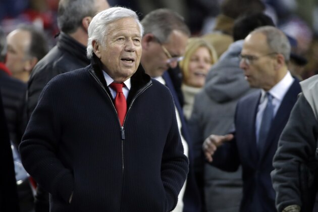 New England Patriots owner Robert Kraft watches his team warm up before an NFL football game against the Buffalo Bills, Saturday, Dec. 21, 2019, in Foxborough, Mass. At right is team president, his son Jonathan Kraft (AP Photo/Elise Amendola)