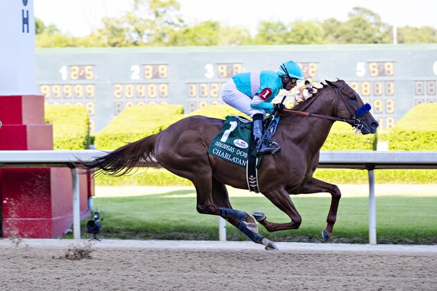 HOT SPRINGS, AR - MAY 02:  Jockey Martin Garcia rides #1 Charlatan to the lead during the 84th running of The Arkansas Derby Grade 1 at Oaklawn Racing Casino Resort on Derby Day during the Covid-19 Pandemic on May 2, 2020 in Hot Springs, Arkansas. (Photo by Wesley Hitt/Getty Images)