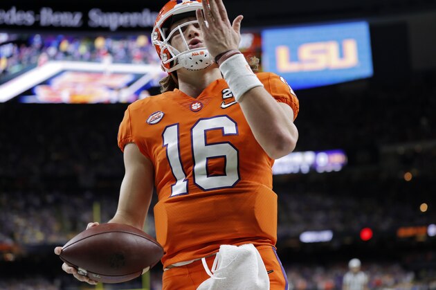 Clemson quarterback Trevor Lawrence celebrates after scoring during the first half of a NCAA College Football Playoff national championship game against LSU Monday, Jan. 13, 2020, in New Orleans. (AP Photo/Gerald Herbert)