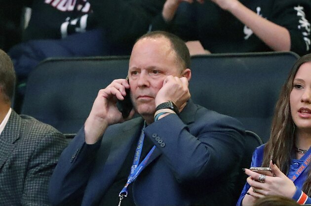 Former player agent and new New York Knicks president Leon Rose, center, takes a phone call during the first quarter of an NBA basketball game against the Houston Rockets in New York, Monday, March 2, 2020. (AP Photo/Kathy Willens)