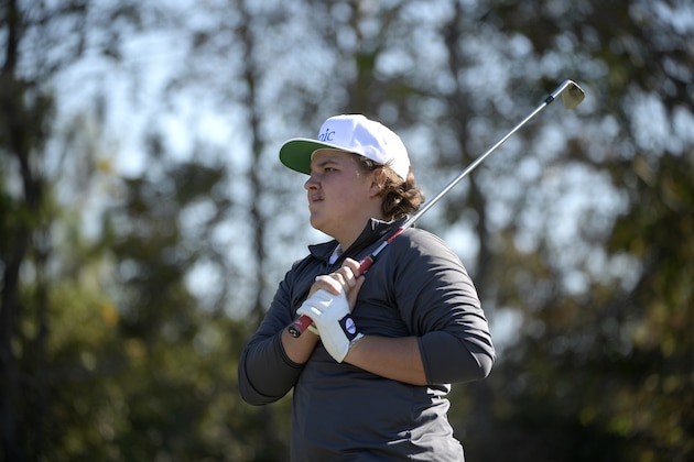 Little John Daly watches after hitting his tee shot on the eighth hole during the first round of the Father Son Challenge golf tournament Saturday, Dec. 7, 2019, in Orlando, Fla. (AP Photo/Phelan M. Ebenhack)