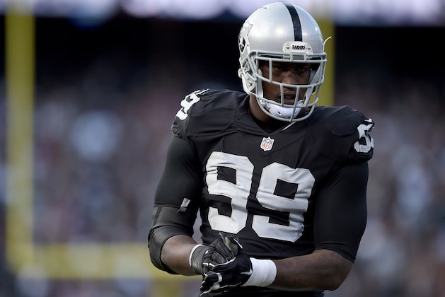 OAKLAND, CA - NOVEMBER 15:  Aldon Smith #99 of the Oakland Raiders looks on during a timeout against the Minnesota Vikings in the third quarter of their NFL football game at O.co Coliseum on November 15, 2015 in Oakland, California.  (Photo by Thearon W. Henderson/Getty Images)