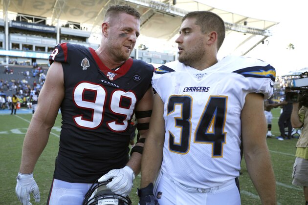 CARSON, CALIFORNIA - SEPTEMBER 22: Defensive end J.J. Watt #99 of the Houston Texans and brother fullback Derek Watt #34 of the Los Angeles Chargers talk after the game at Dignity Health Sports Park on September 22, 2019 in Carson, California. (Photo by Meg Oliphant/Getty Images)