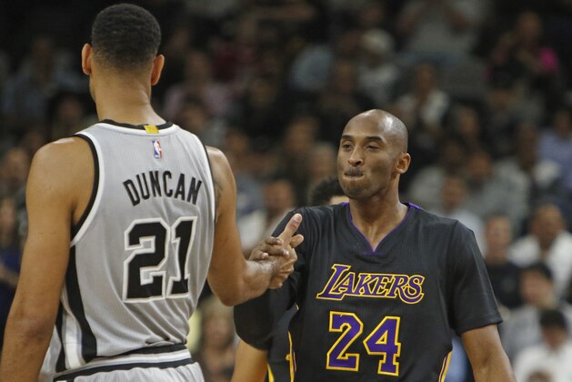 SAN ANTONIO, TX - DECEMBER 11: Kobe Bryant #24 of the Los Angeles Lakers greets Tim Duncan #21 of the San Antonio Spurs before the start of their game  at AT&T Center on December 11, 2015 in San Antonio, Texas.  NOTE TO USER: User expressly acknowledges and agrees that , by downloading and or using this photograph, User is consenting to the terms and conditions of the Getty Images License Agreement. (Photo by Ronald Cortes/Getty Images)