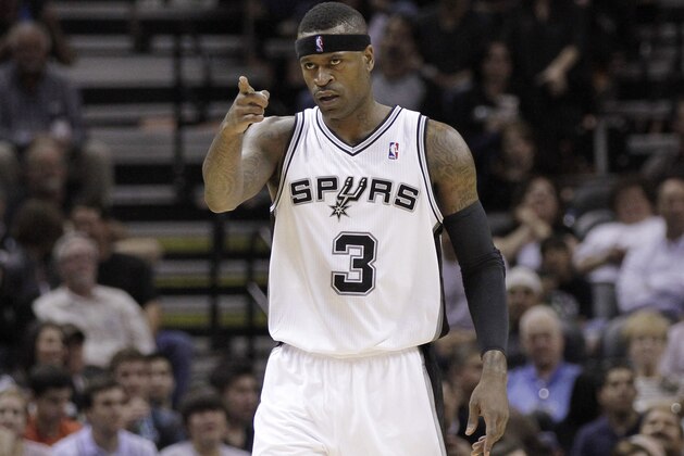 San Antonio Spurs' Stephen Jackson acknowledges teammates during the first quarter of an NBA basketball game against the Minnesota Timberwolves,Wednesday, March 21, 2012, in San Antonio. (AP Photo/Eric Gay)