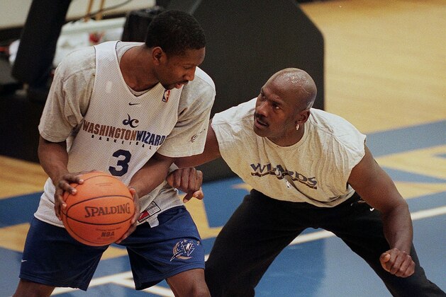 Washington Wizards co-owner Michael Jordan (R) practices with Wizard Laron Profit at the MCI Center 31 January 2000, in Washington, DC. Jordan said he practiced with the team to evaluate players.    AFP PHOTO    Mario TAMA (Photo by MARIO TAMA / AFP) (Photo by MARIO TAMA/AFP via Getty Images)