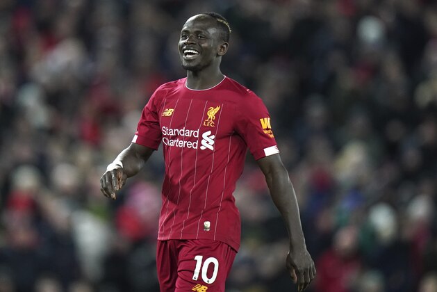 Liverpool's Sadio Mane reacts after having a goal disallowed during the English Premier League soccer match between Liverpool and West Ham at Anfield Stadium in Liverpool, England, Monday, Feb. 24, 2020. (AP Photo/Jon Super)