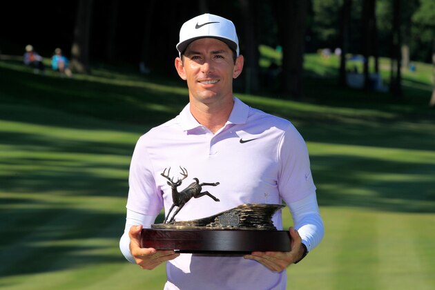 SILVIS, ILLINOIS - JULY 14:  Dylan Frittelli of South Africa celebrates with the trophy after winning the John Deere Classic at TPC Deere Run on July 14, 2019 in Silvis, Illinois. (Photo by Andy Lyons/Getty Images)