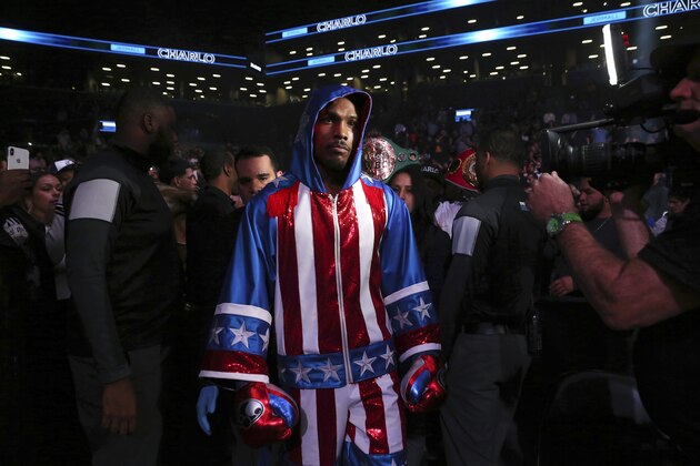 Jermall Charlo enters the arena before the WBC middleweight boxing match against Dennis Hogan, Saturday, Dec. 7, 2019, in New York. (AP Photo/Michael Owens)