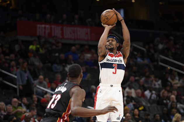 Washington Wizards guard Bradley Beal (3) shoots against Miami Heat forward Bam Adebayo (13) during the second half of an NBA basketball game, Sunday, March 8, 2020, in Washington. The Heat won 100-89. (AP Photo/Nick Wass)