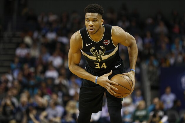 Milwaukee Bucks forward Giannis Antetokounmpo runs the offense against the Charlotte Hornets in the first half of an NBA basketball game in Charlotte, N.C., Sunday, March 1, 2020. Milwaukee won 93-85. (AP Photo/Nell Redmond)