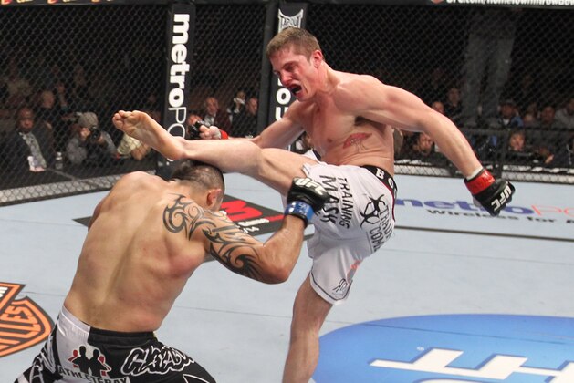 LAS VEGAS, NV - FEBRUARY 04:  (R-L) Matt Riddle kicks Henry Martinez during the UFC 143 event at Mandalay Bay Events Center on February 4, 2012 in Las Vegas, Nevada.  (Photo by Nick Laham/Zuffa LLC/Zuffa LLC via Getty Images)
