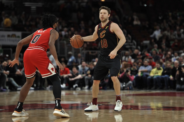 Cleveland Cavaliers' Matthew Dellavedova (18) of Australia, looks to pass against Chicago Bulls' Coby White (0) during the first half of an NBA basketball game Tuesday, March 10, 2020, in Chicago. Chicago won 108-103. (AP Photo/Paul Beaty)