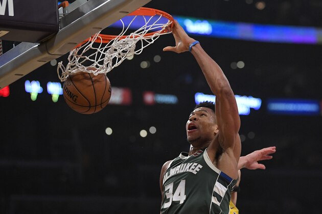 Milwaukee Bucks forward Giannis Antetokounmpo dunks during the first half of an NBA basketball game against the Los Angeles Lakers Friday, March 6, 2020, in Los Angeles. (AP Photo/Mark J. Terrill)