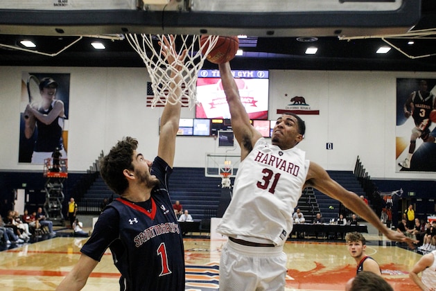 Harvard forward Seth Towns, right, goes to the basket while defended by Saint Mary's center Jordan Hunter during the first half of an NCAA college basketball game at the Wooden Legacy tournament Thursday, Nov. 23, 2017, in Fullerton, Calif. (AP Photo/Ringo H.W. Chiu)