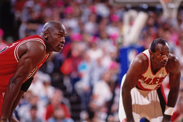 PORTLAND, OR - JUNE 07:  Michael Jordan #23 of the Chicago Bulls and Clyde Drexler #22 of the Portland Trail Blazers stand on the court in Game Three of the NBA Finals at Memorial Coliseum on June 7, 1992 in Portland, Oregon. NOTE TO USER: User expressly acknowledges and agrees that, by downloading and/or using this Photograph, user is consenting to the terms and conditions of the Getty Images License Agreement. Mandatory Copyright Notice: Copyright 1992 NBAE (Photo by Andrew D. Bernstein/NBAE via Getty Images)