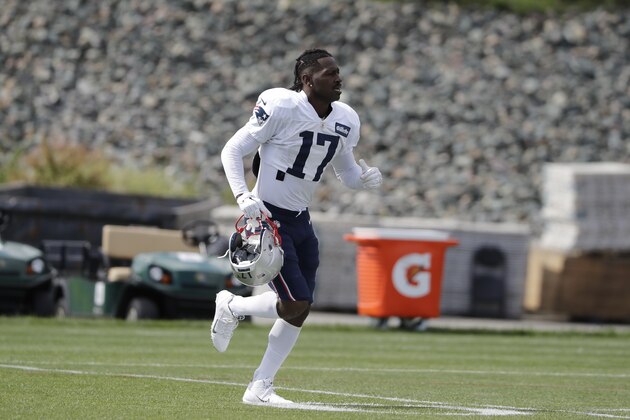New England Patriots wide receiver Antonio Brown carries his helmet during an NFL football practice, Wednesday, Sept. 18, 2019, in Foxborough, Mass. (AP Photo/Steven Senne)