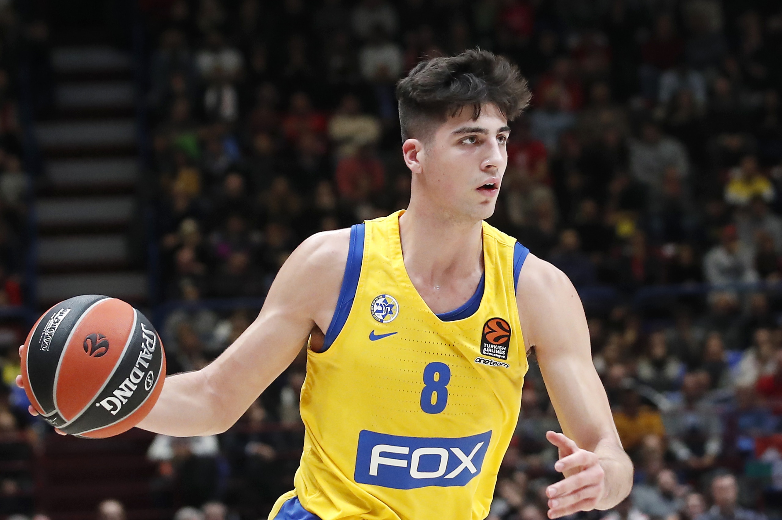 Maccabi Fox Tel Aviv's Deni Avdija controls the ball during the Euro League basketball match between Olimpia Milan and Maccabi Fox Tel Aviv, in Milan, Italy, Tuesday, Nov. 19, 2019. (AP Photo/Antonio Calanni) Maccabi Fox Tel Aviv's Deni Avdija controls the ball during the Euro League basketball match between Olimpia Milan and Maccabi Fox Tel Aviv, in Milan, Italy, Tuesday, Nov. 19, 2019. (AP Photo/Antonio Calanni)