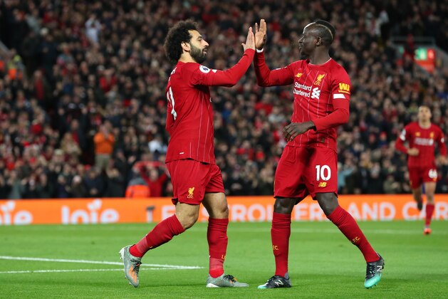 LIVERPOOL, ENGLAND - JANUARY 02:  Mohamed Salah of Liverpool celebrates with Sadio Mane after scoring the opening goal during the Premier League match between Liverpool FC and Sheffield United at Anfield on January 02, 2020 in Liverpool, United Kingdom. (Photo by Alex Livesey - Danehouse/Getty Images)