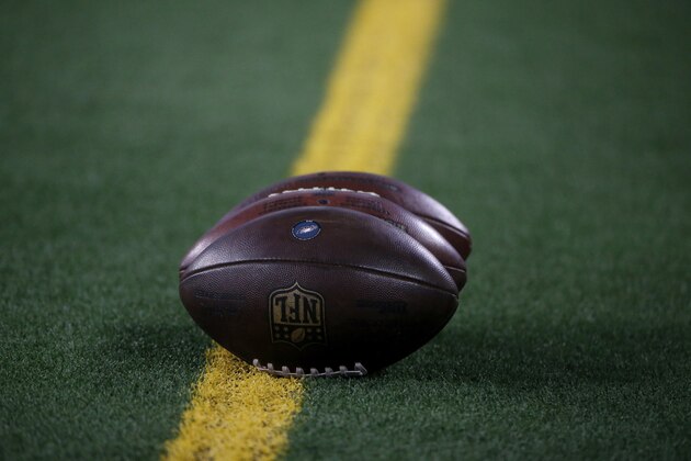 Footballs with the Philadelphia Eagles logo lay on the field before an NFL football game against the Dallas Cowboys in Arlington, Texas, Sunday, Oct. 20, 2019. (AP Photo/Michael Ainsworth)