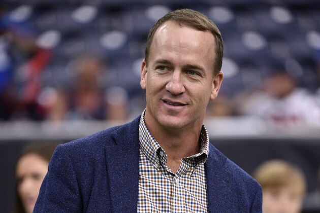Former NFL quarterback Peyton Manning watches from the sideline before an NFL football game between the New York Giants and Houston Texans Sunday, Sept. 23, 2018, in Houston. (AP Photo/Eric Christian Smith)