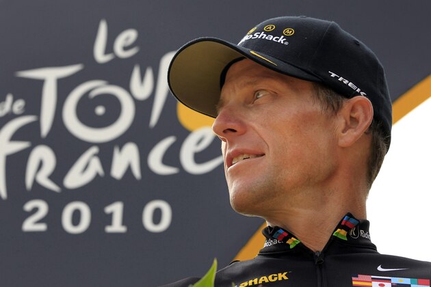 FILE- In this  July 25, 2010, file photo, Lance Armstrong, of the United States, looks back on the podium after the 20th and last stage of the Tour de France cycling race in Paris. Armstrong’s $100 million civil fraud trial is months away, yet his fight with the government and former teammate-turned-rival Floyd Landis is heating up. The trial is scheduled for November in federal court in Washington D.C., and lawyers for both sides recently filed a series of motions asking U.S. District Judge Christopher Cooper to exclude some key evidence. (AP Photo/Bas Czerwinski, File)
