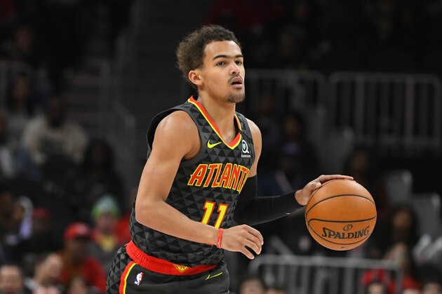 Atlanta Hawks guard Trae Young (11) dribbles upcourt during an NBA basketball game against the Charlotte Hornets, Monday, March 9, 2020, in Atlanta. (AP Photo/John Amis)