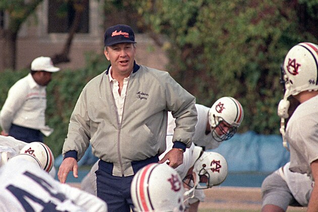 Auburn coach Pat Dye walks through his players as they begin workouts in preparation for the Sugar Bowl in New Orleans, Dec. 27, 1988.  Dye will lead the Tigers against Florida State on January 2.  (AP Photo/Bill Haber)