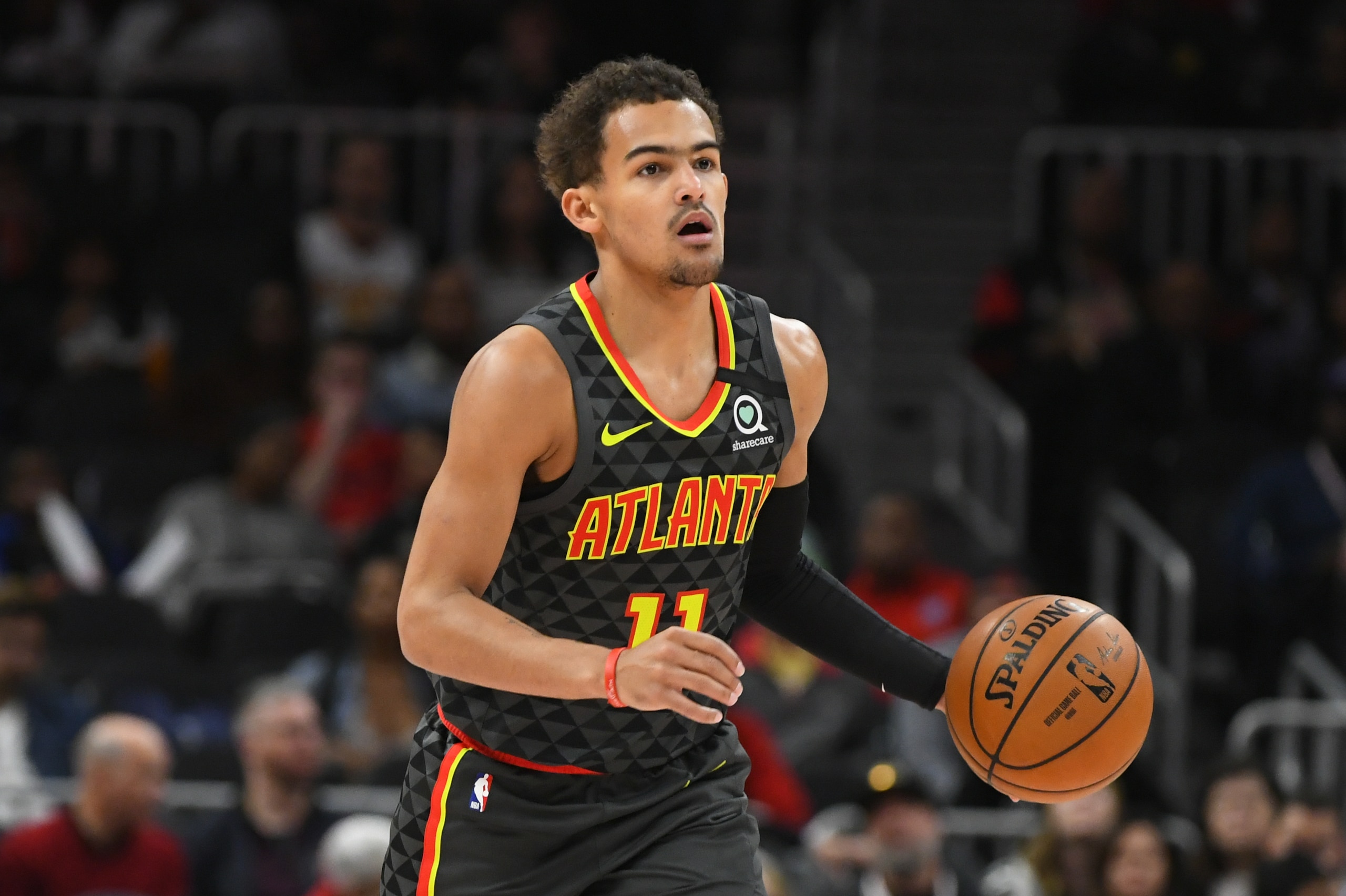 Atlanta Hawks guard Trae Young (11) works during an NBA basketball game against the Charlotte Hornets, Monday, March 9, 2020, in Atlanta. (AP Photo/John Amis) Atlanta Hawks guard Trae Young (11) works during an NBA basketball game against the Charlotte Hornets, Monday, March 9, 2020, in Atlanta. (AP Photo/John Amis)