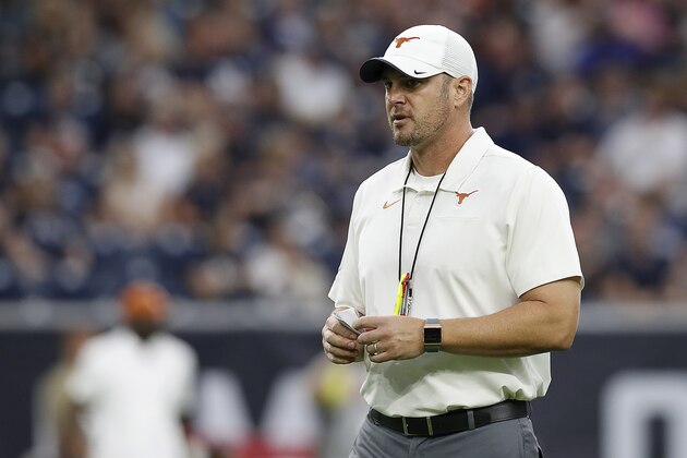 HOUSTON, TX - SEPTEMBER 14:  Head coach Tom Herman of the Texas Longhorns watches players warm up before the game against the Rice Owls at NRG Stadium on September 14, 2019 in Houston, Texas.  (Photo by Tim Warner/Getty Images)