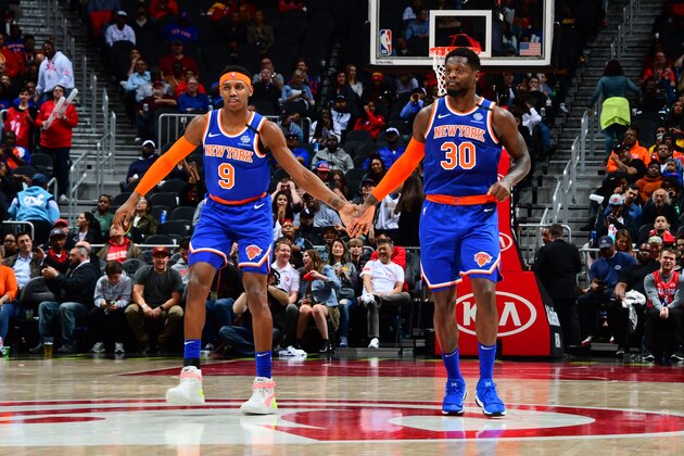 ATLANTA, GA - MARCH 11: RJ Barrett #9 high fives his teammate, Julius Randle #30 during the game against the Atlanta Hawks on March 11, 2020 at State Farm Arena in Atlanta, Georgia.  NOTE TO USER: User expressly acknowledges and agrees that, by downloading and/or using this Photograph, user is consenting to the terms and conditions of the Getty Images License Agreement. Mandatory Copyright Notice: Copyright 2020 NBAE (Photo by Scott Cunningham/NBAE via Getty Images)