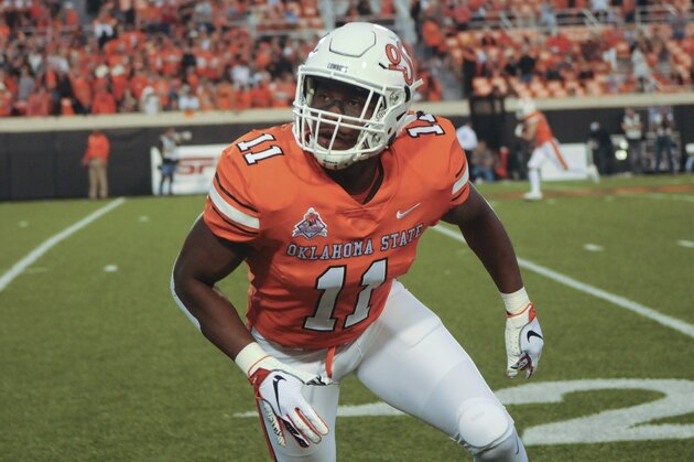Oklahoma State linebacker Amen Ogbongbemiga warms up prior to an NCAA college football game in Stillwater, Okla., Saturday, Oct. 27, 2018. (AP Photo/Brody Schmidt)