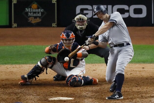 New York Yankees' DJ LeMahieu hits a two-run home run against the Houston Astros during the ninth inning in Game 6 of baseball's American League Championship Series Saturday, Oct. 19, 2019, in Houston. (AP Photo/Sue Ogrocki)