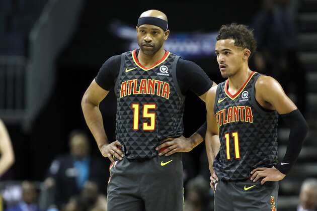 Atlanta Hawks' Vince Carter (15) huddles with teammate Trae Young (11) during the second half of an NBA basketball game against the Charlotte Hornets in Charlotte, N.C., Sunday, Dec. 8, 2019. The Hawks won 122-107. (AP Photo/Bob Leverone) Atlanta Hawks' Vince Carter (15) huddles with teammate Trae Young (11) during the second half of an NBA basketball game against the Charlotte Hornets in Charlotte, N.C., Sunday, Dec. 8, 2019. The Hawks won 122-107. (AP Photo/Bob Leverone)
