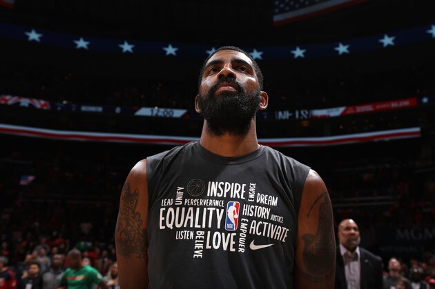 WASHINGTON, DC - FEBRUARY 1: Kyrie Irving #11 of the Brooklyn Nets stands for the national anthem before the game against the Washington Wizards on February 1, 2020 at Capital One Arena in Washington, DC. NOTE TO USER: User expressly acknowledges and agrees that, by downloading and or using this Photograph, user is consenting to the terms and conditions of the Getty Images License Agreement. Mandatory Copyright Notice: Copyright 2020 NBAE (Photo by Stephen Gosling/NBAE via Getty Images) WASHINGTON, DC - FEBRUARY 1: Kyrie Irving #11 of the Brooklyn Nets stands for the national anthem before the game against the Washington Wizards on February 1, 2020 at Capital One Arena in Washington, DC. NOTE TO USER: User expressly acknowledges and agrees that, by downloading and or using this Photograph, user is consenting to the terms and conditions of the Getty Images License Agreement. Mandatory Copyright Notice: Copyright 2020 NBAE (Photo by Stephen Gosling/NBAE via Getty Images)