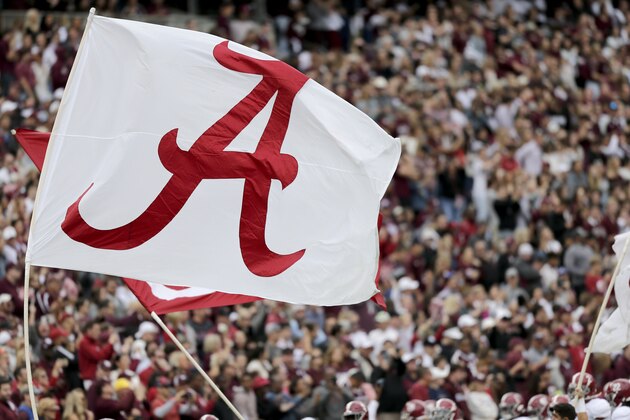 The Alabama flag waves over the crowd at Kyle Field before the start of an NCAA college football game against Texas A&M, Saturday, Oct. 12, 2019, in College Station, Texas. (AP Photo/Sam Craft)