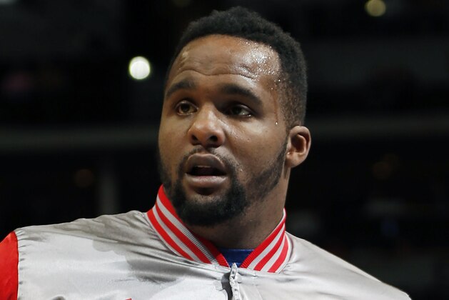 FILE - In this April 4, 2015, file photo, Los Angeles Clippers forward Glen Davis warms up before facing the Denver Nuggets in an NBA basketball game, in Denver. Former NBA player Glen “Big Baby” Davis has agreed to pay $15,000 to avoid jail time on drug charges. News outlets report the forward had faced up to five years in jail. He was arrested at a Maryland hotel with 126 grams (4 ounces) of marijuana and a briefcase containing $92,000 last February, and indicted on seven counts of drug possession and distribution. (AP Photo/David Zalubowski, File)