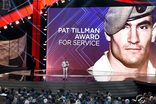 LOS ANGELES, CALIFORNIA - JULY 10: An image of the late Pat Tillman is projected on a screen while Usher presents an award onstage during The 2019 ESPYs at Microsoft Theater on July 10, 2019 in Los Angeles, California. (Photo by Kevin Winter/Getty Images) LOS ANGELES, CALIFORNIA - JULY 10: An image of the late Pat Tillman is projected on a screen while Usher presents an award onstage during The 2019 ESPYs at Microsoft Theater on July 10, 2019 in Los Angeles, California. (Photo by Kevin Winter/Getty Images)