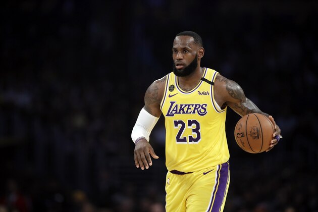 Los Angeles Lakers' LeBron James (23) dribbles during the first half of an NBA basketball game against the Brooklyn Nets Tuesday, March 10, 2020, in Los Angeles. (AP Photo/Marcio Jose Sanchez)