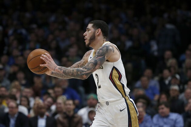 New Orleans Pelicans guard Lonzo Ball (2) passes the ball against the Dallas Mavericks during the second half of an NBA basketball game in Dallas, Wednesday, March 4, 2020. (AP Photo/Michael Ainsworth)