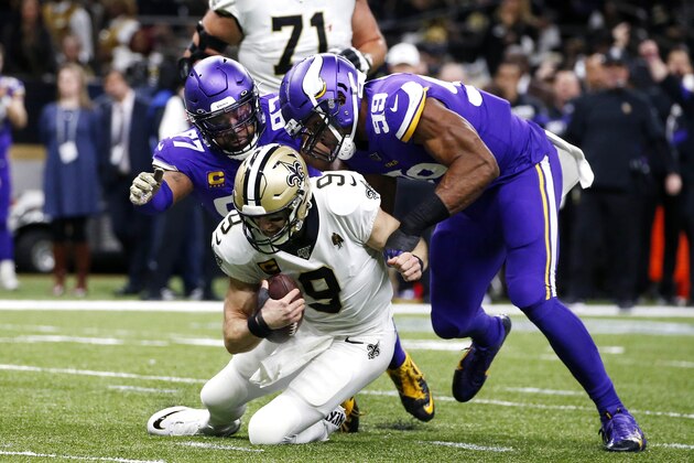 New Orleans Saints quarterback Drew Brees (9) is sacked by Minnesota Vikings defensive end Danielle Hunter (99) and defensive end Everson Griffen (97) in the first half of an NFL wild-card playoff football game, Sunday, Jan. 5, 2020, in New Orleans. (AP Photo/Butch Dill)