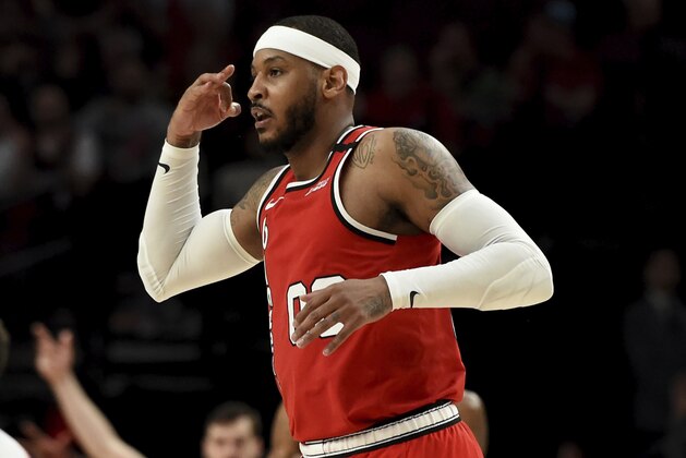 Portland Trail Blazers forward Carmelo Anthony reacts after making a shot during the second half of the team's NBA basketball game against the Phoenix Suns in Portland, Ore., Tuesday, March 10, 2020. The Blazers won 121-105. (AP Photo/Steve Dykes)