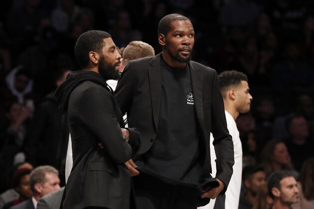 NEW YORK, NEW YORK - JANUARY 10:  (NEW YORK DAILIES OUT)  Kyrie Irving #11 (L) and Kevin Durant #7 of the Brooklyn Nets during a game against the Miami Heat at Barclays Center on January 10, 2020 in New York City. The Nets defeated the Heat 117-113.
NOTE TO USER: User expressly acknowledges and agrees that, by downloading and or using this photograph, User is consenting to the terms and conditions of the Getty Images License Agreement. (Photo by Jim McIsaac/Getty Images)