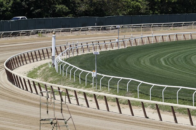 The far turn at Belmont Race Track is empty of action, Wednesday, May 27, 2020, in Elmont, N.Y. The track is the site of the Belmont Stakes race, usually the third leg of horse racing's Triple Crown. This year, however, due to concerns over the spread of the coronavirus, the race will be held as the first leg of the Triple Crown, and no spectators will be allowed. The race was rescheduled from early June to June 20, 2020. (AP Photo/Kathy Willens)