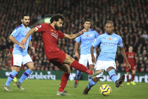 Liverpool's Mohamed Salah makes an attempt to score during the English Premier League soccer match between Liverpool and Manchester City at Anfield stadium in Liverpool, England, Sunday, Nov. 10, 2019. (AP Photo/Jon Super)