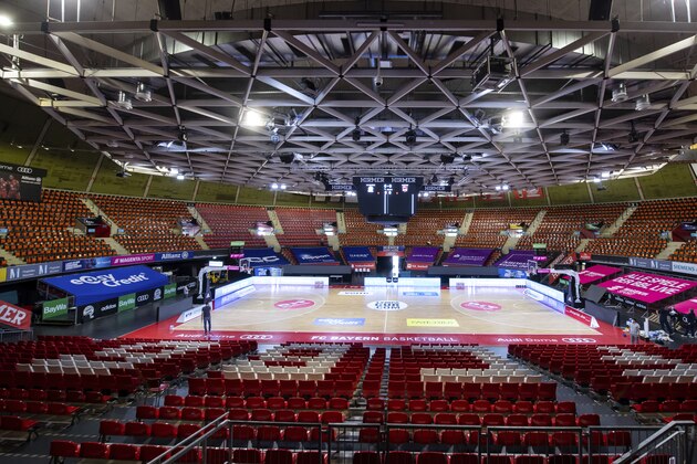 In this Tuesday, June 2, 2020 photo, people work on final preparations for the start of the Basketball Bundesliga in the sports arena Audi Dome in Munich. As the second major team sport after soccer, basketball will resume playing in Germany from Saturday, June 6, 2020 despite the Corona pandemic. (Sven Hoppe/dpa via AP) In this Tuesday, June 2, 2020 photo, people work on final preparations for the start of the Basketball Bundesliga in the sports arena Audi Dome in Munich. As the second major team sport after soccer, basketball will resume playing in Germany from Saturday, June 6, 2020 despite the Corona pandemic. (Sven Hoppe/dpa via AP)