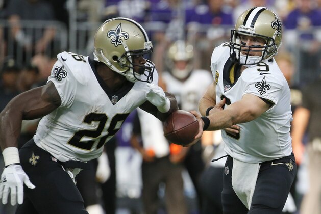 New Orleans Saints quarterback Drew Brees (9) hands the ball off to running back Adrian Peterson during the first half of an NFL football game against the Minnesota Vikings, Monday, Sept. 11, 2017, in Minneapolis. (AP Photo/Bruce Kluckhohn) New Orleans Saints quarterback Drew Brees (9) hands the ball off to running back Adrian Peterson during the first half of an NFL football game against the Minnesota Vikings, Monday, Sept. 11, 2017, in Minneapolis. (AP Photo/Bruce Kluckhohn)