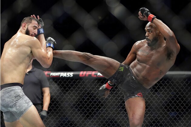 Dominick Reyes, left, and Jon Jones, right, during a light heavyweight mixed martial arts bout at UFC 247 Saturday, Feb. 8, 2020, in Houston. (AP Photo/Michael Wyke)